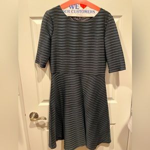 Get ready for the holiday season with this Donna Morgan Fit and Flare dress